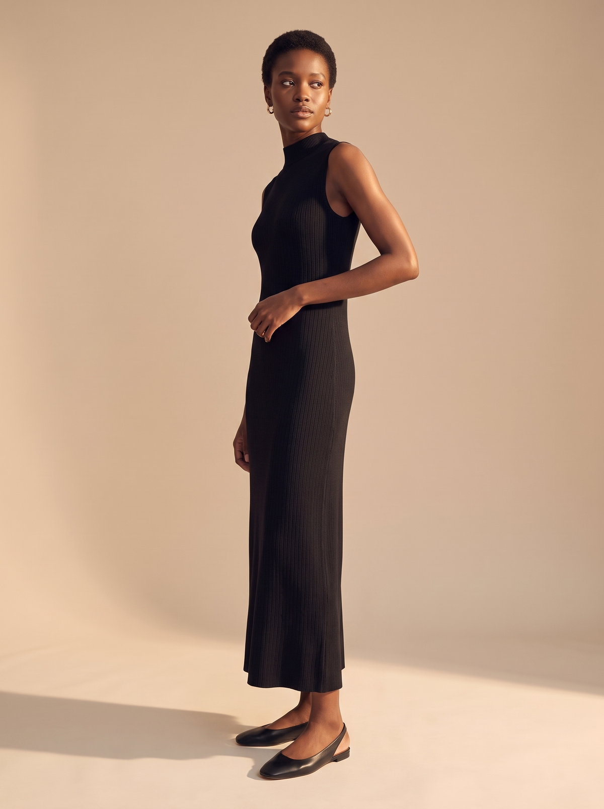 Sleeveless Ribbed Mock Neck Maxi Dress in Black, three-quarter view