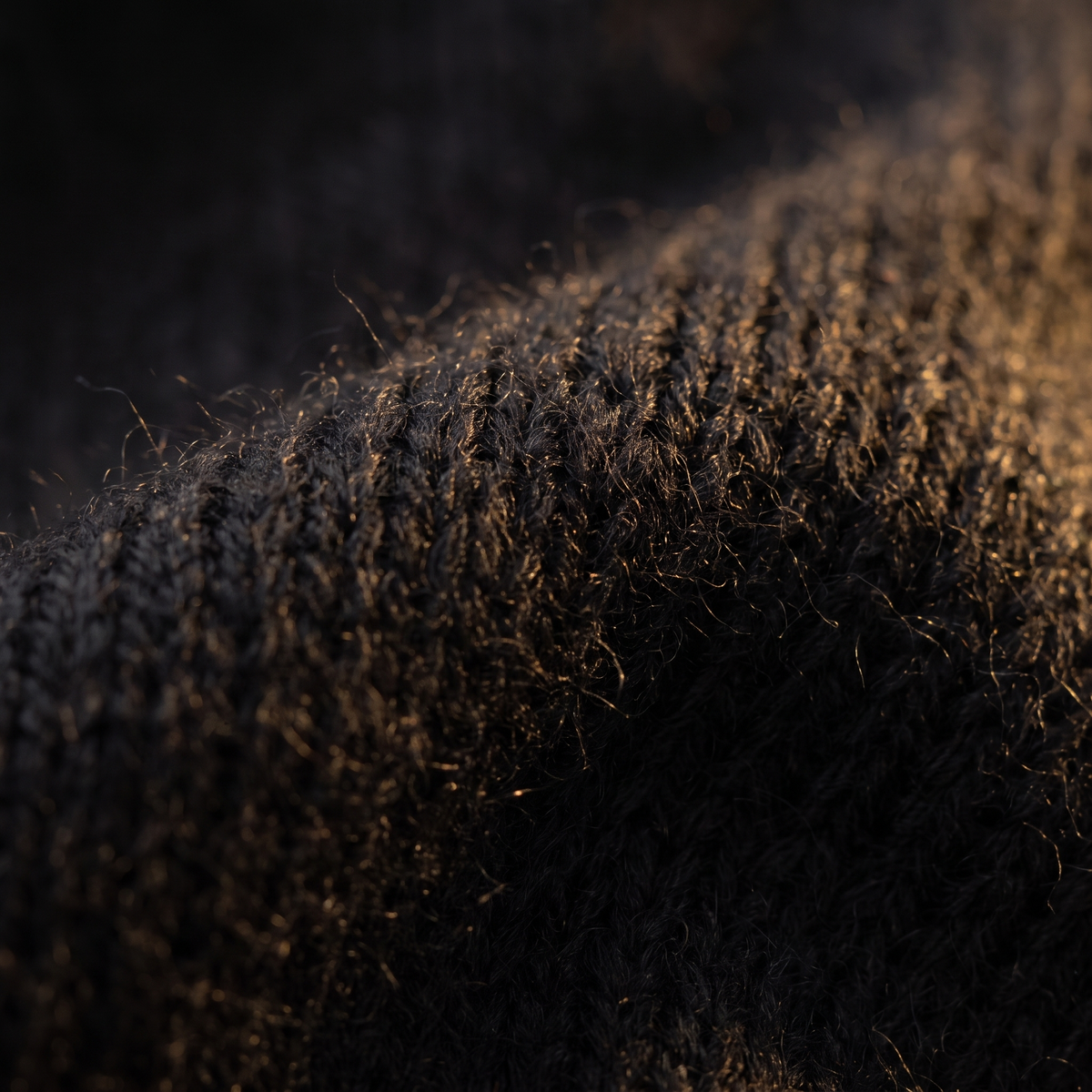 Slim Turtleneck Sweater in Black, close-up of the knit