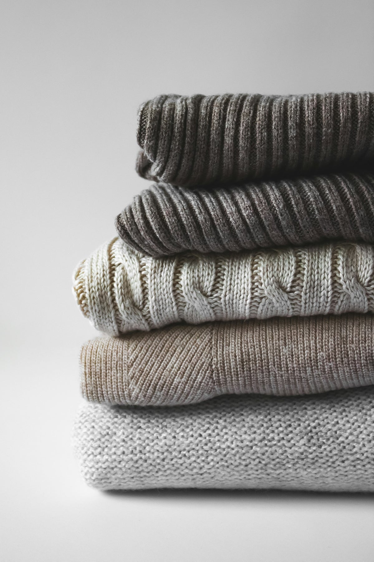 Close-up of a soft cream knit texture